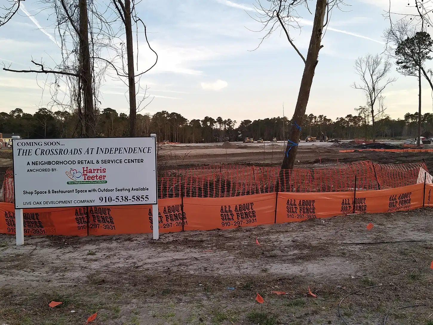 Silt fencing and a sign at the start of construction on The Crossroads at Independence, a shopping center in Wilmington