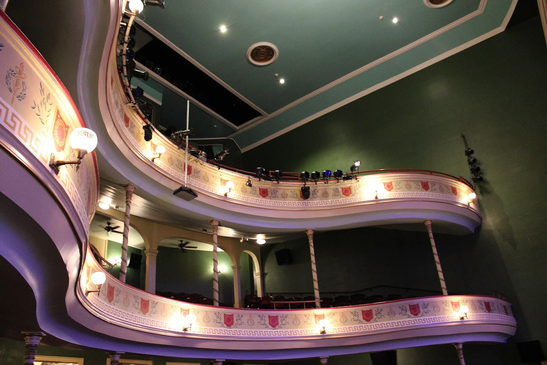 The curved, lit balconies inside Thalian Hall, the 1858 theater on Chestnut Street in downtown Wilmington.