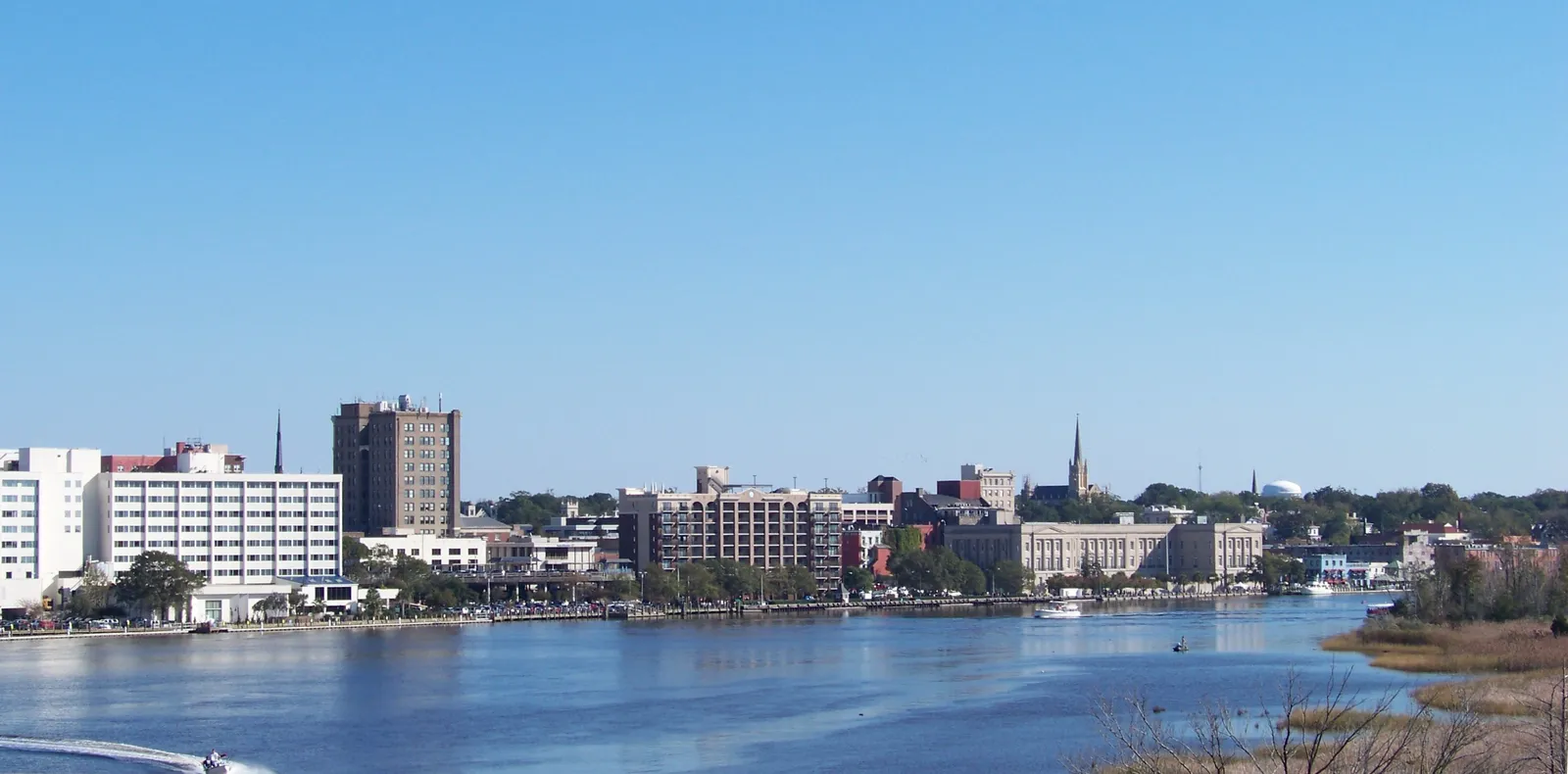 Downtown Wilmington's riverfront seen across the Cape Fear River, Riverfest's home since 1979
