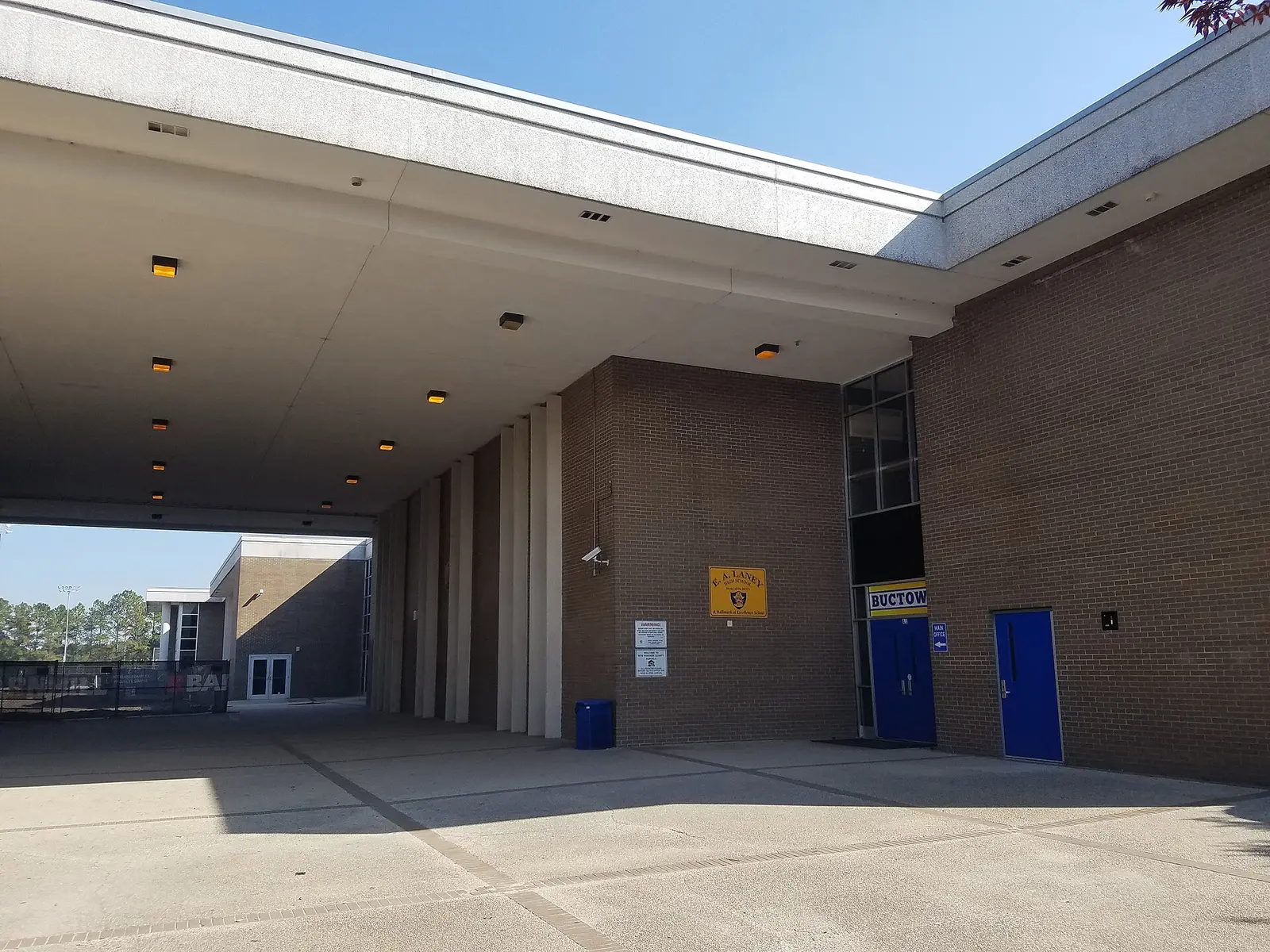 The covered entrance and main office of Emsley A. Laney High School in Wilmington