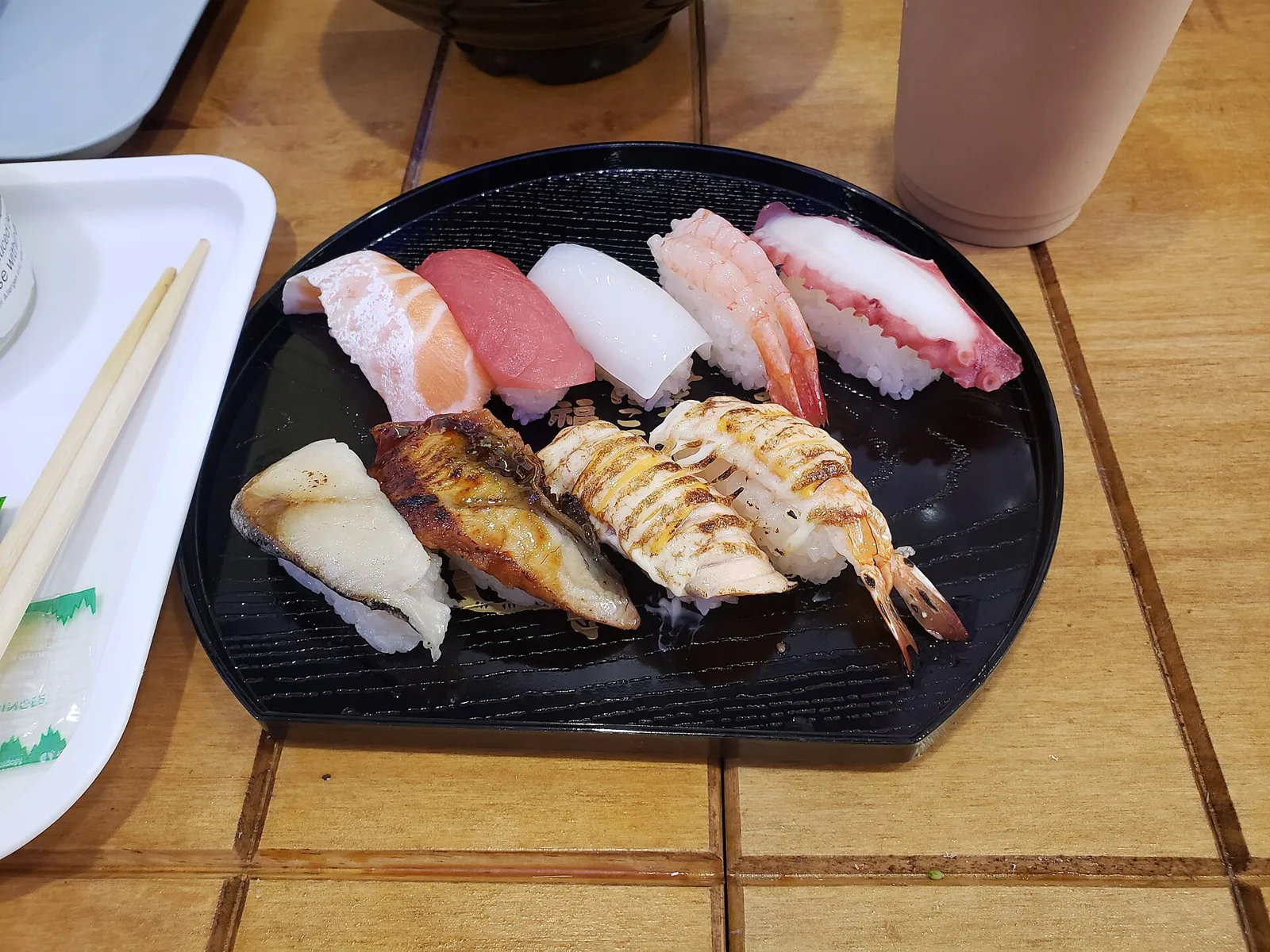 A plate of nigiri sushi with salmon, tuna, squid, shrimp and octopus. The photo was not taken at a Wilmington restaurant.