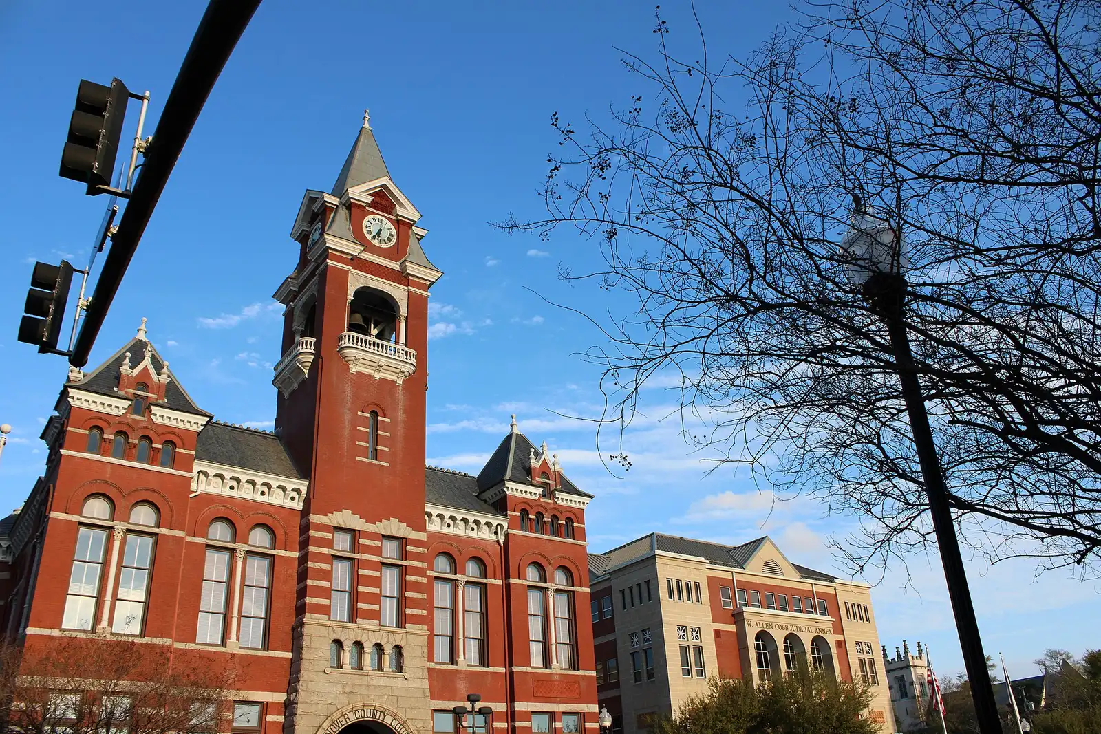 The clock tower of the historic New Hanover County Courthouse, with the W. Allen Cobb Judicial Annex beside it, in downtown Wilmington