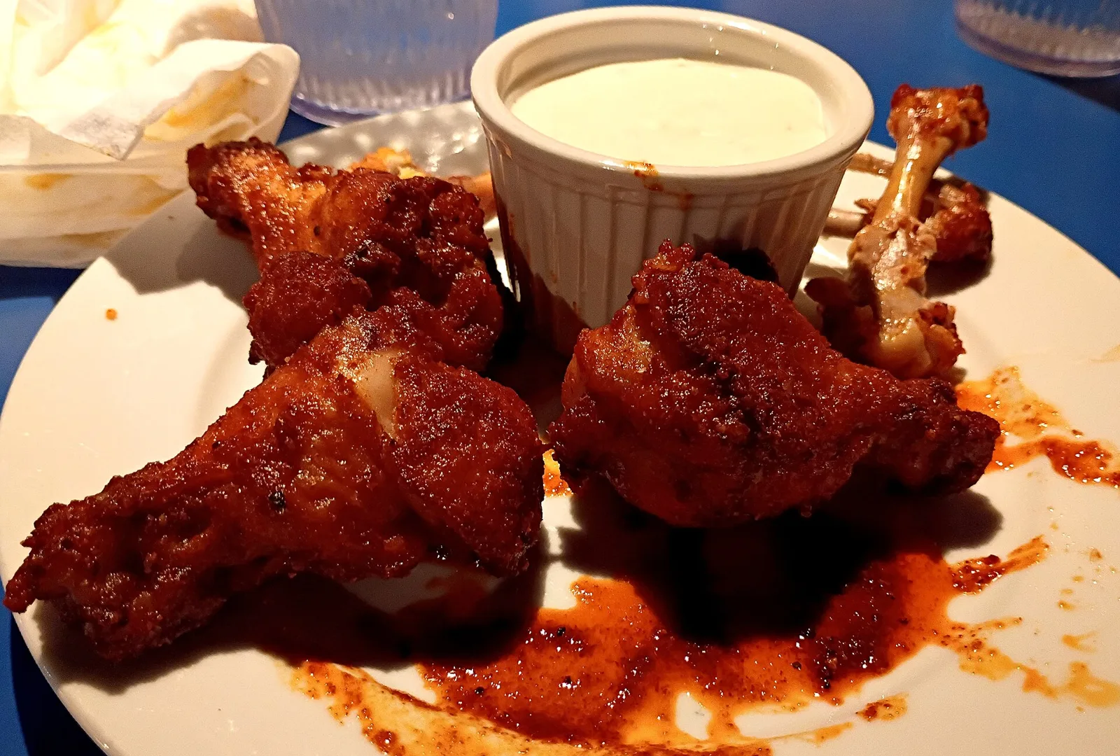 Fried chicken wings with a cup of blue cheese dressing. The photo was not taken at a Wilmington restaurant.